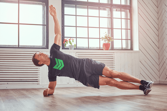 Man performing side plank in a private gym for individualized training in Berlin