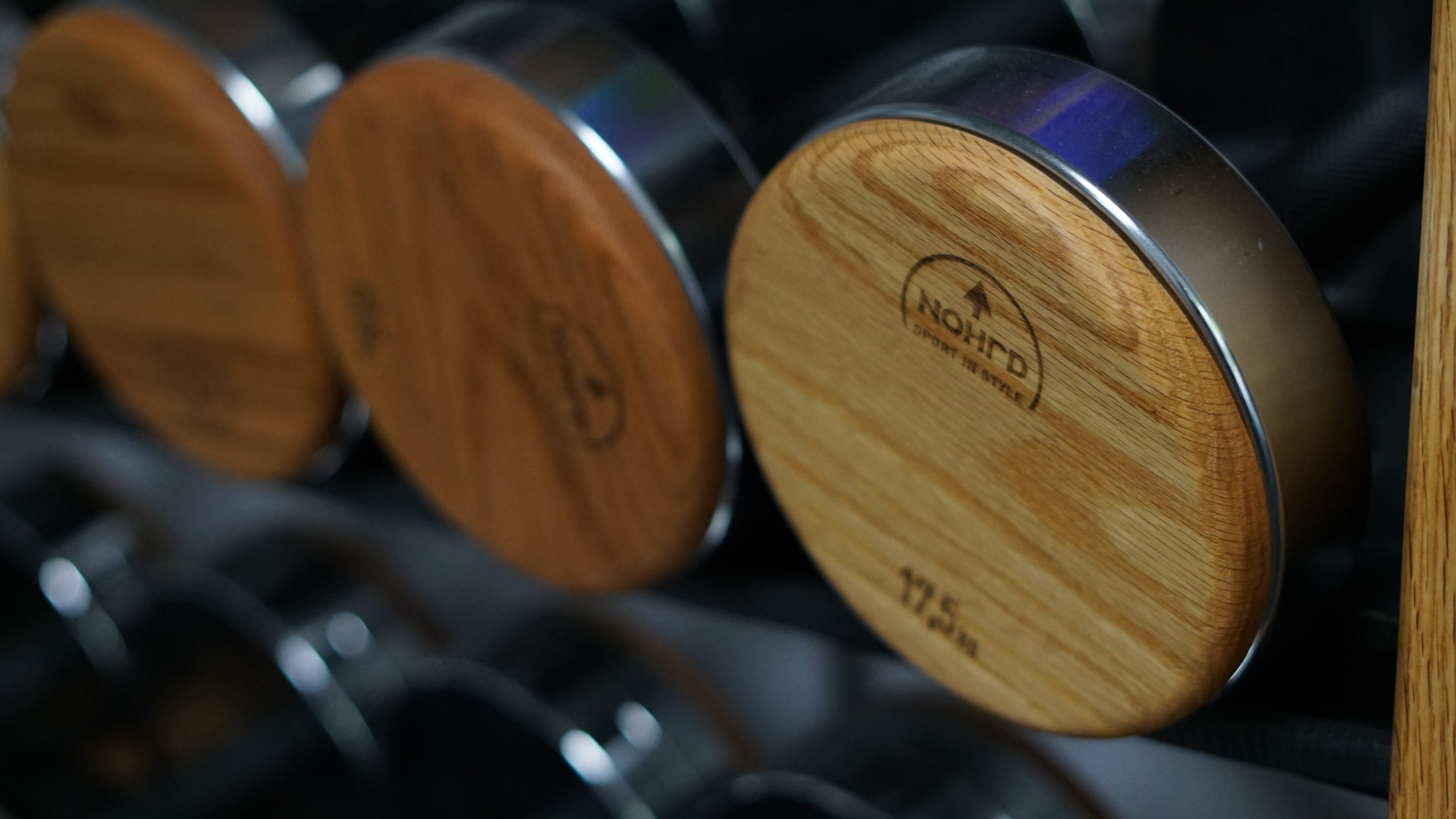 close up of Nohrd dumbbells with wood and metal